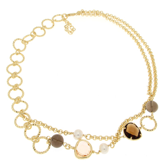 Gold necklace with textured circular links and smooth chains, featuring a light brown gemstone, a darker round bead, and a pearl.