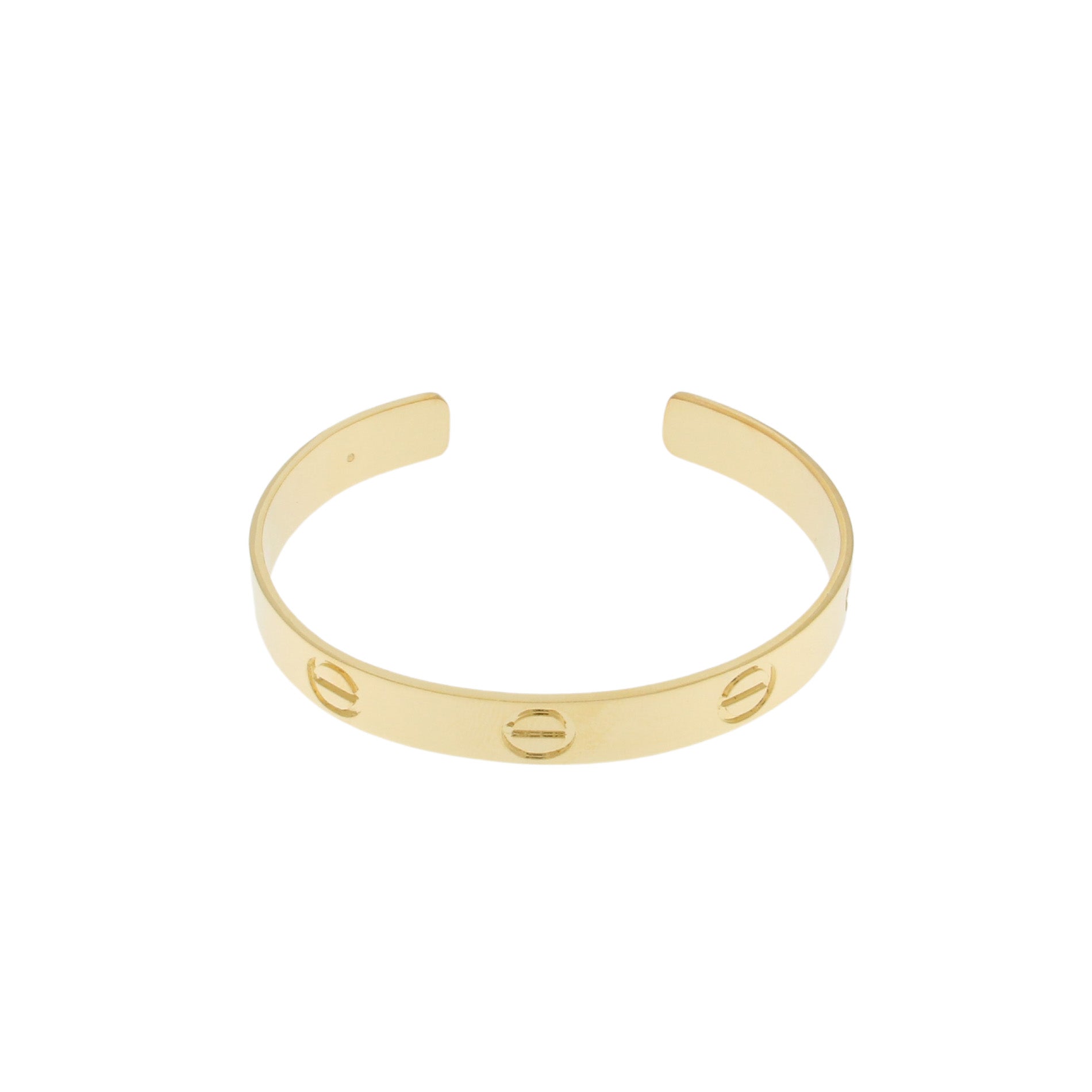 A sleek gold-tone cuff bracelet featuring a minimalist design with three circular cutouts evenly spaced along the band. The bracelet has a polished finish, adding a touch of elegance to its simple and modern style.