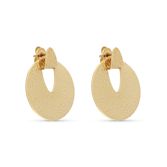 A pair of gold-tone earrings featuring a circular design with a cut-out at the top. The surface of each earring is textured with a hammered finish, creating a subtle shine and adding visual interest. The earrings are secured with post-back closures, ensuring they sit comfortably on the earlobes. Their contemporary style makes them a versatile accessory suitable for both casual and formal outfits.