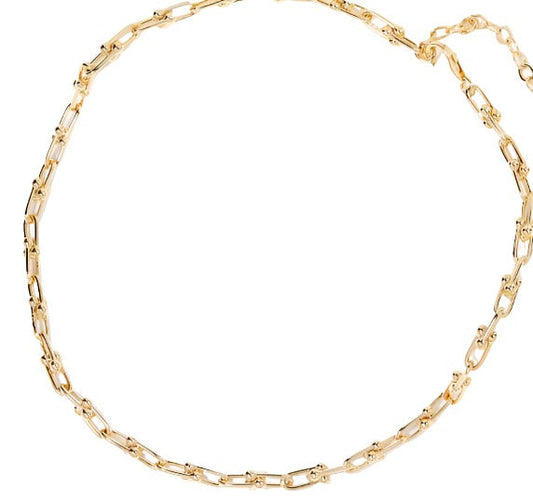 Gold chain necklace with elongated rectangular links and small round beads interspersed throughout.